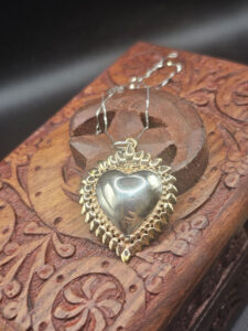 Cuore sacro Santa Muerte argento e oro